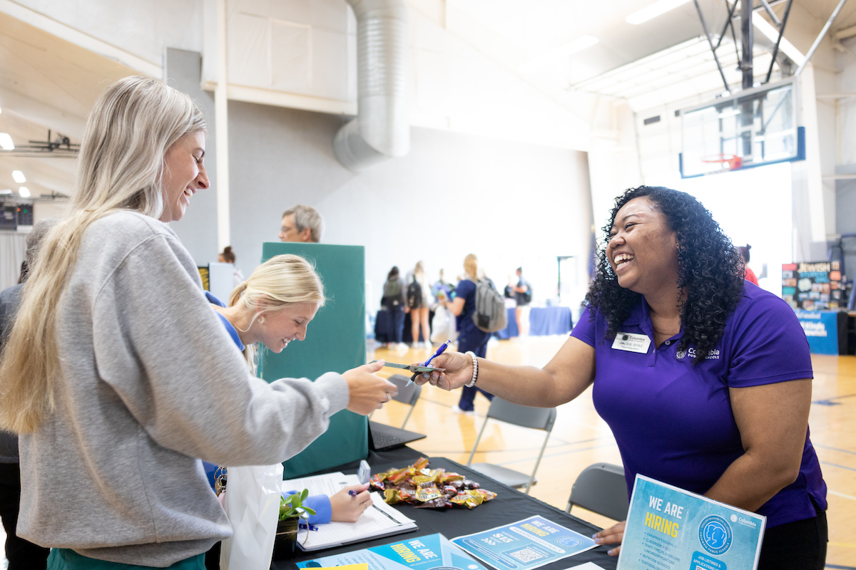 Students interact with staff during the Hey Day event.