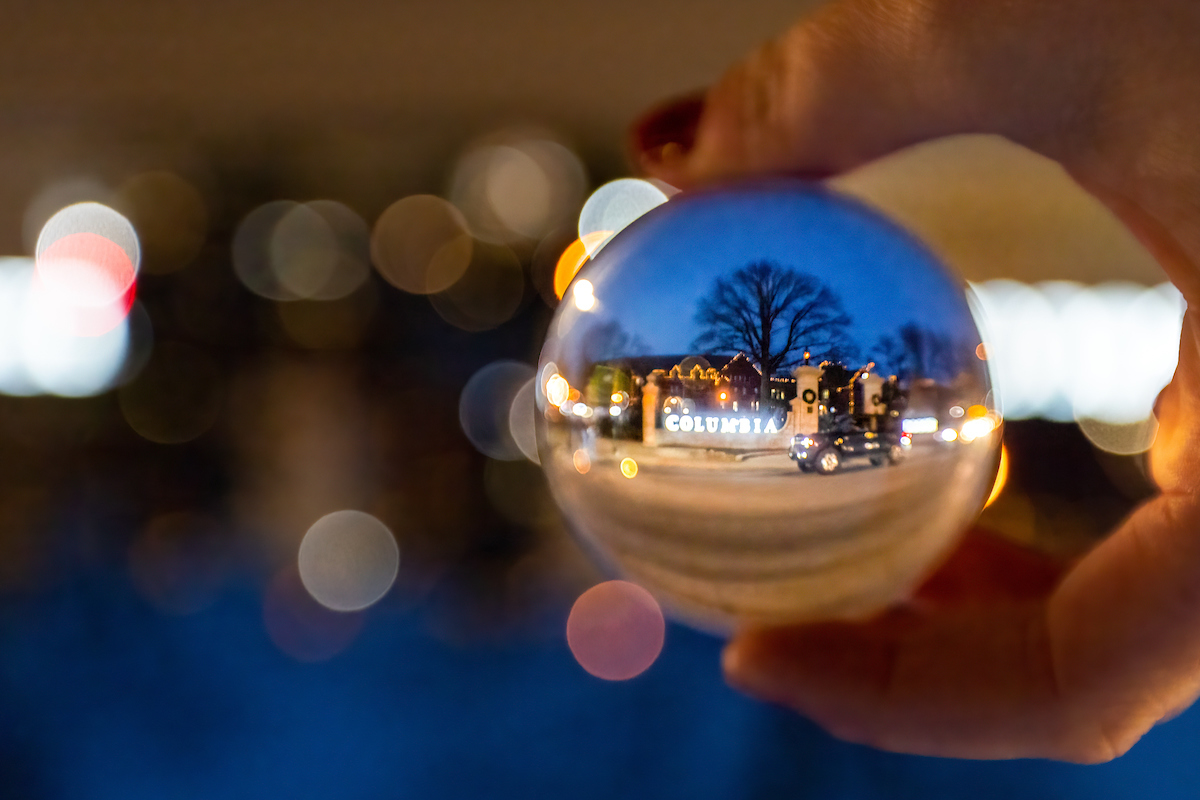 Rogers gate during the holidays, as seen through an image in an ornament.