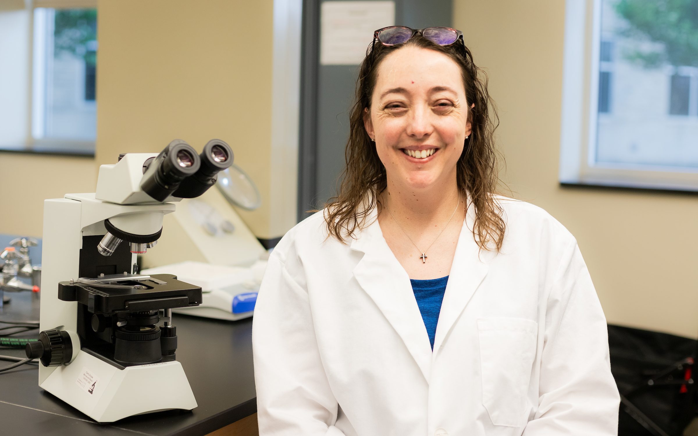 Dr. Tara Martin surrounded by lab equipment.