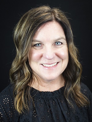 A portrait of Dean Kristi Clevenger, smiling at the camera.