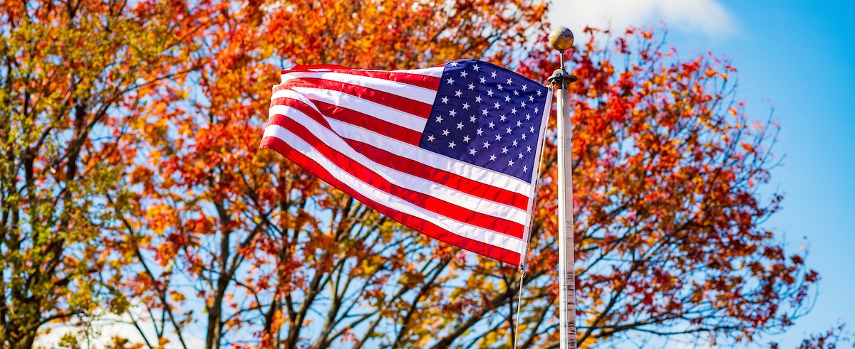 Close up of the American flag waving in the breeze outside on the main campus.